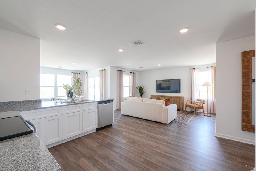 A living room with a large television. A living room with a large television.