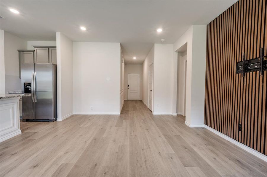 Unfurnished living room featuring recessed lighting and light wood finished floors