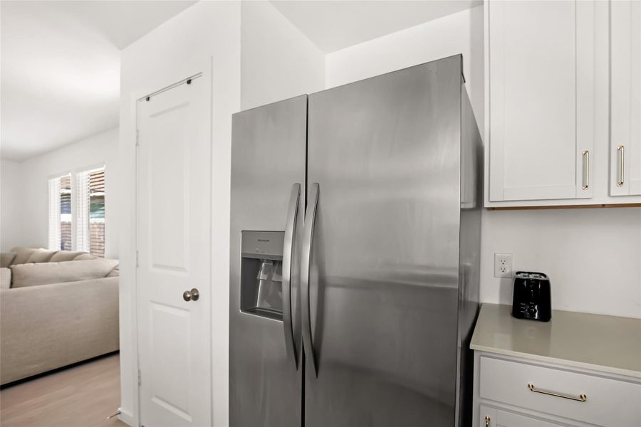 Pantry and refrigerator veiw.