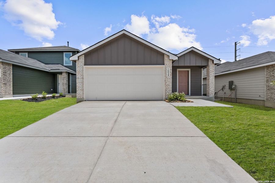 Front exterior of a new home in Hickory Ridge, Elmendorf, TX, highlighting curb appeal (Image 1). Front exterior of a new home in Hickory Ridge, Elmendorf, TX, highlighting curb appeal (Image 1).