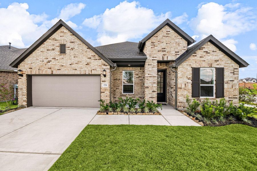 Front exterior of a new home in Lago Mar: Fairway Collections, Texas City, TX, highlighting curb appeal (Image 21). Front exterior of a new home in Lago Mar: Fairway Collections, Texas City, TX, highlighting curb appeal (Image 21).