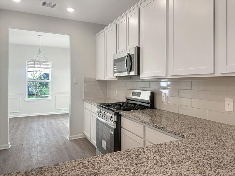 The Caldwell- Kitchen. Home is under construction. Sample image for illustration; upgrades, options, and colors may vary.