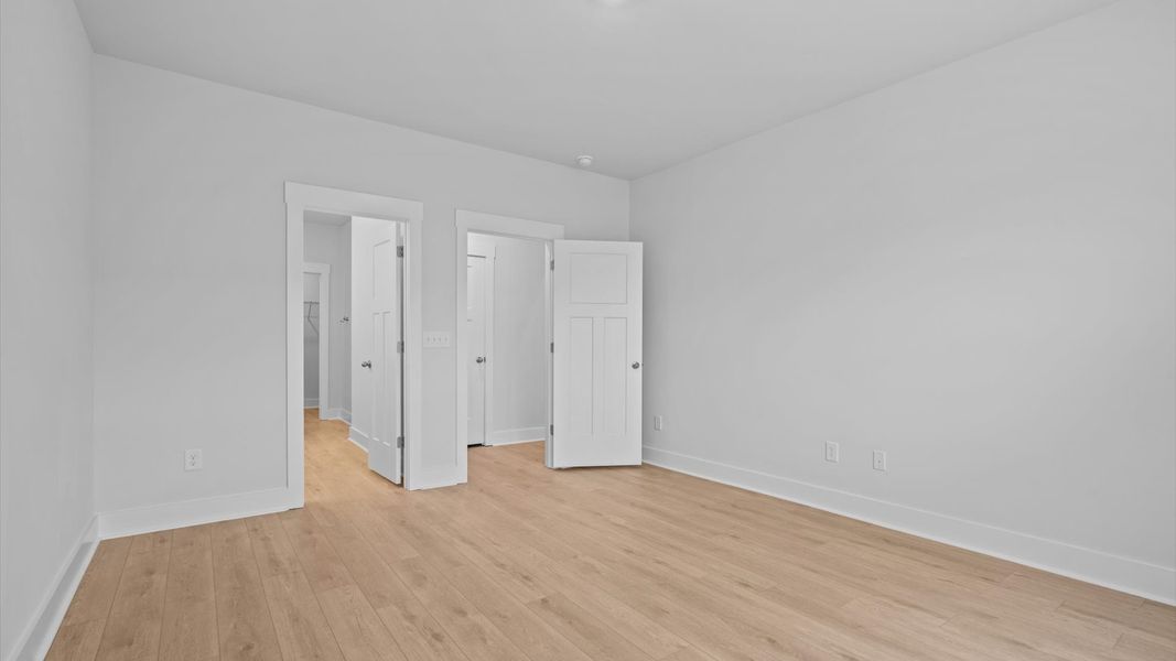 Highly skilled design shines in this elegant, restful primary suite