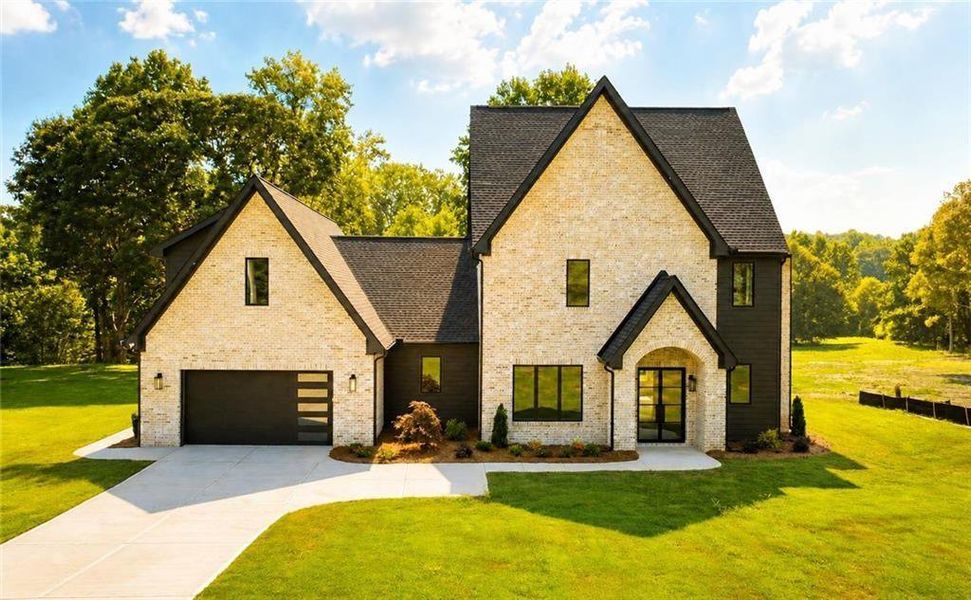 Front exterior of a new home in , Flowery Branch, GA, highlighting curb appeal (Image 26). Front exterior of a new home in , Flowery Branch, GA, highlighting curb appeal (Image 26).