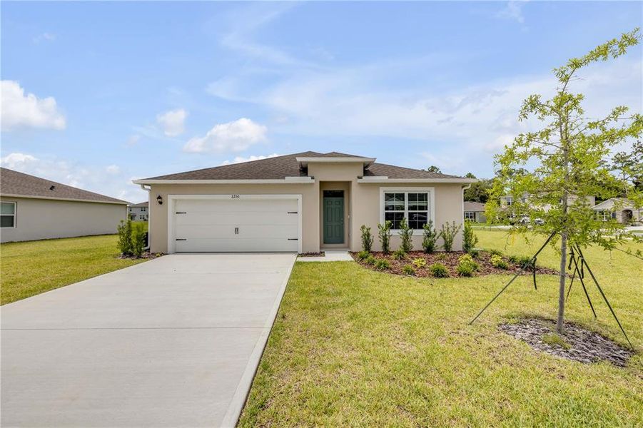 Front exterior of a new home in , New Smyrna Beach, FL, highlighting curb appeal (Image 21). Front exterior of a new home in , New Smyrna Beach, FL, highlighting curb appeal (Image 21).