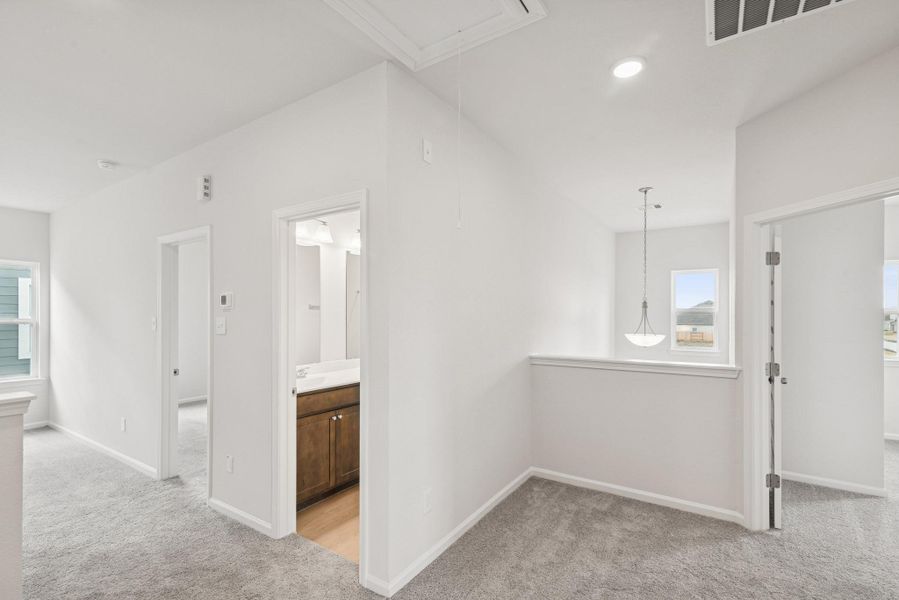 The Georgetown II- Hall to Upstairs Bedrooms and Bath 2. Home under construction, photo used for illustrative purposes only, colors and options will vary.