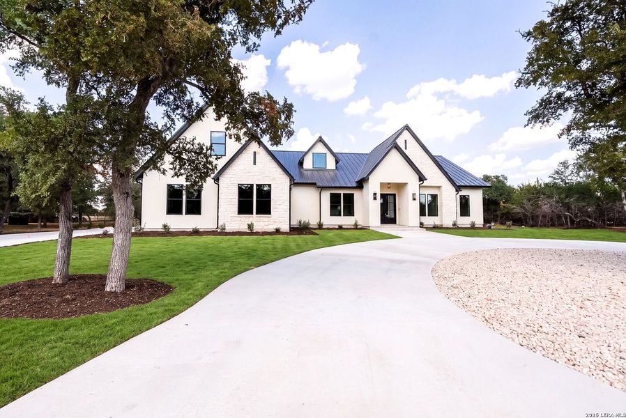 Front exterior of a new home in , Boerne, TX, highlighting curb appeal (Image 28).