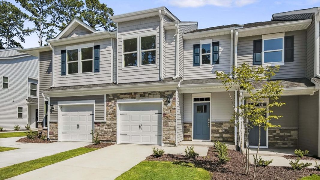 Front exterior of a new home in Chapel Townes, Raleigh, NC, highlighting curb appeal (Image 25).