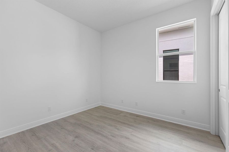 Furnished interior view inside a new home in PGA Village Verano, Port St. Lucie (Image 17).