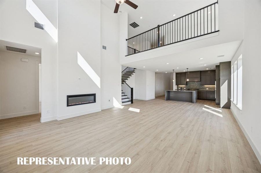 With the upstairs game room open the main family room, you'll enjoy multi-level entertaining in our Percy plan. REPRESENTATIVE PHOTO