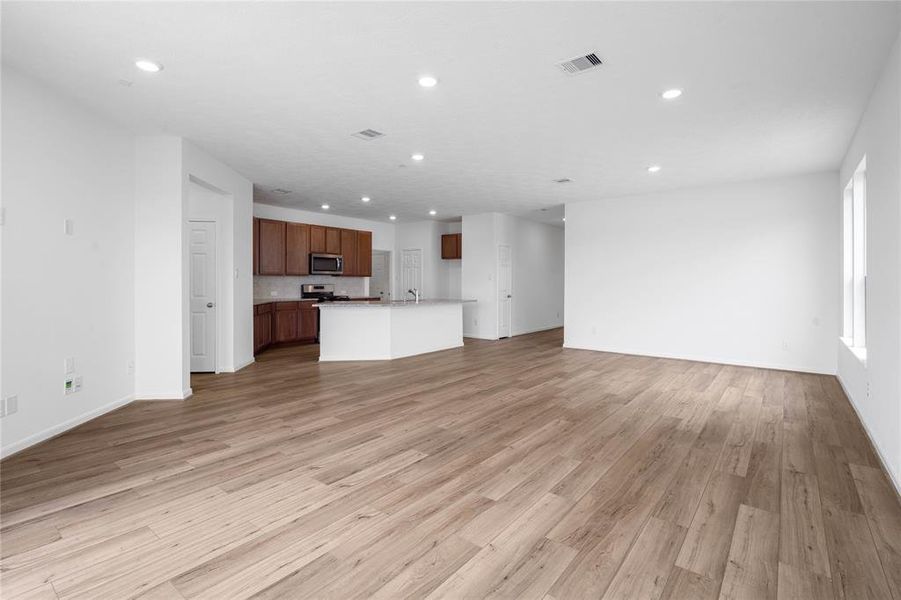 Another gorgeous view of the great room looking into the kitchen and dining area.