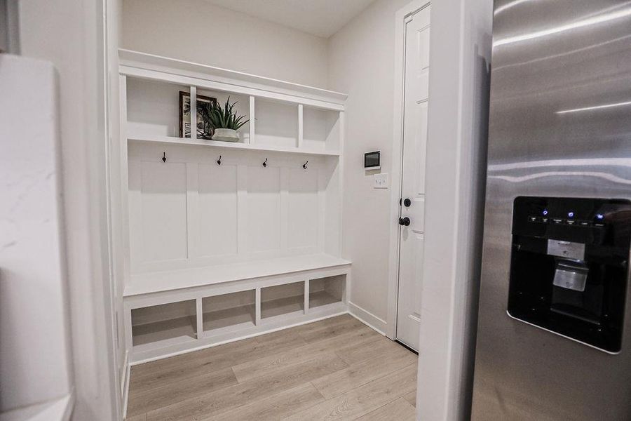 Mudroom featuring light wood-style flooring