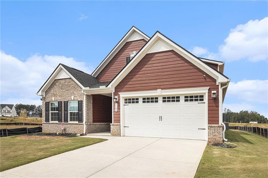 Front exterior of a new home in , McDonough, GA, highlighting curb appeal (Image 2).