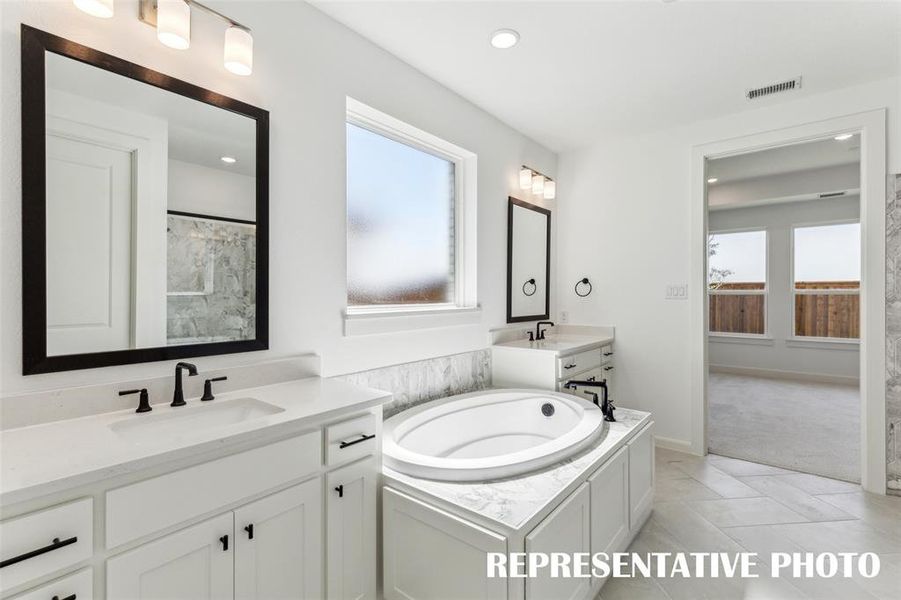 Plenty of room for two int his beautiful owner's bath.  REPRESENTATIVE PHOTO