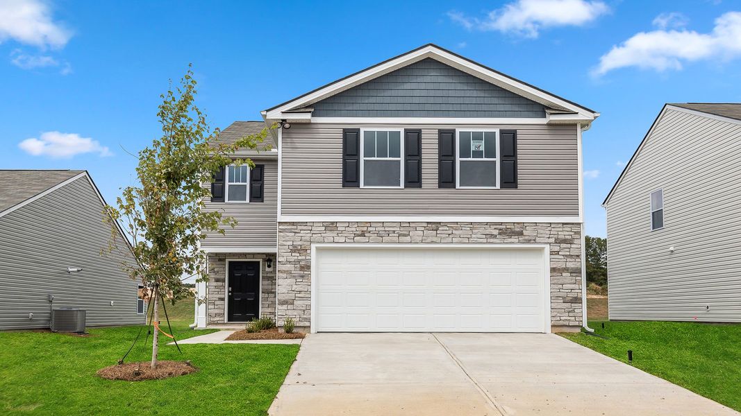 Front exterior of a new home in Durbin Meadows, Fountain Inn, SC, highlighting curb appeal (Image 1).