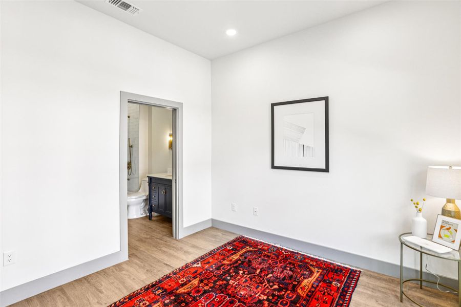 Sitting room featuring light wood-type flooring and recessed lighting