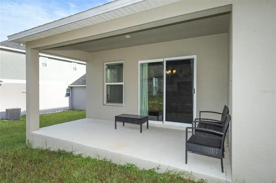 Exterior details and patio area of a home in The Reserve at Lake Ridge II, Minneola (Image 3).