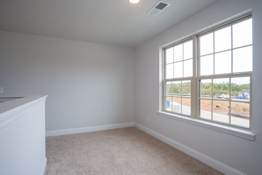 Representative unfurnished interior of a home built from the 3030 by Adams Homes in Parkland Place, Pace (Image 28).
