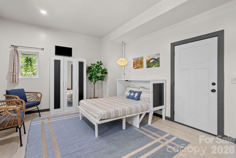 Hidden inside the attractive custom furniture is a convenient fold out queen bed! (Bed conveys)