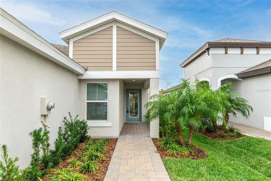 Exterior details and patio area of a home in Crosswind Point, Parrish (Image 24).
