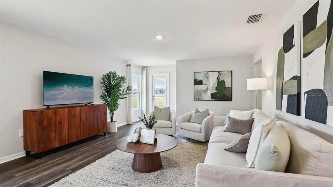 Furnished interior view inside a new home in Lake Deer Estates, Poinciana (Image 3).