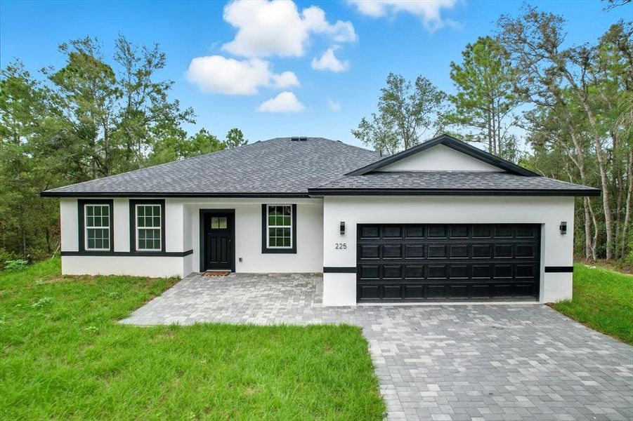Front exterior of a new home in , Citrus Springs, FL, highlighting curb appeal (Image 18).