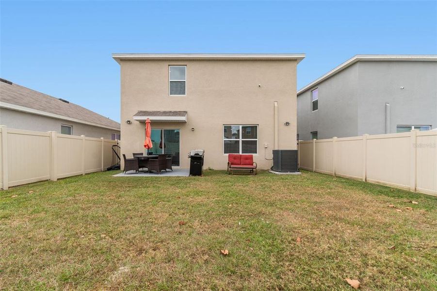Exterior details and patio area of a home in Westgate at Avalon Park, Wesley Chapel (Image 37).