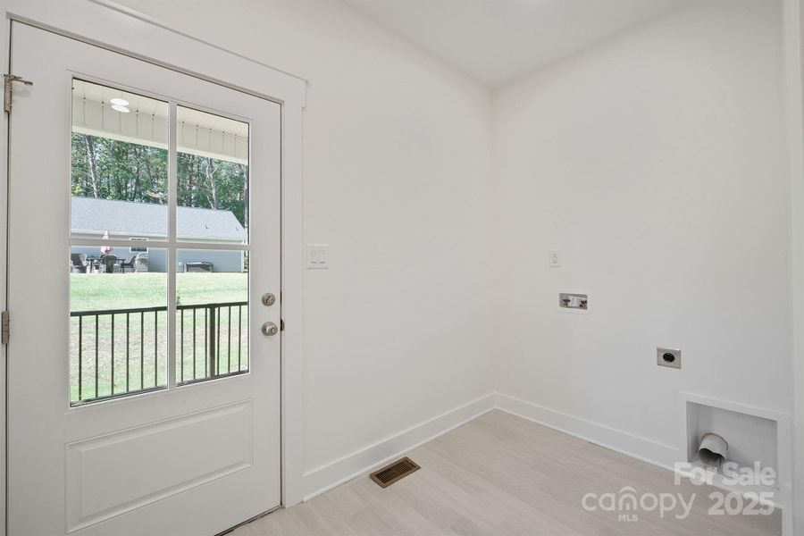 Laundry/mud room from covered side porch entrance