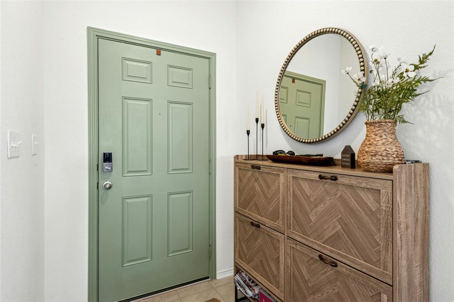 Foyer featuring light tile patterned floors