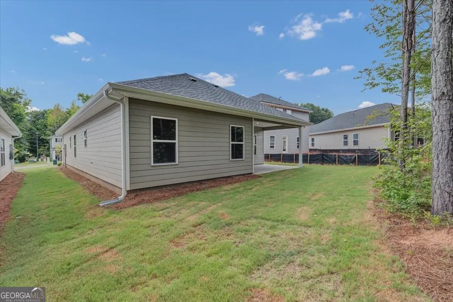 Exterior details and patio area of a home in Canterbury Villas, Carrollton (Image 4).