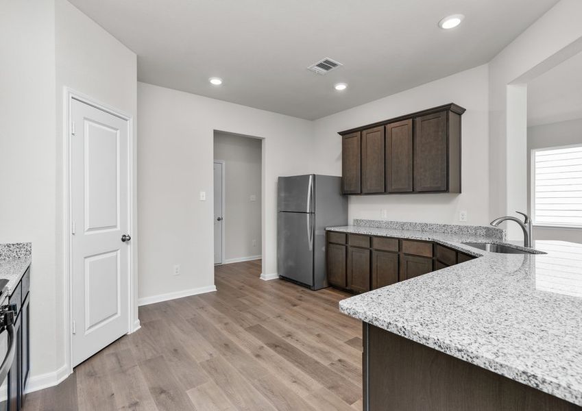 The kitchen has sprawling granite countertops. The kitchen has sprawling granite countertops.