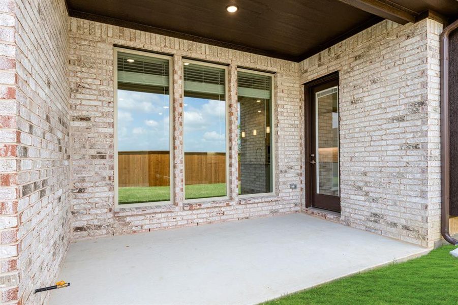 Exterior details and patio area of a home in Creekview Meadows, Pilot Point (Image 4).