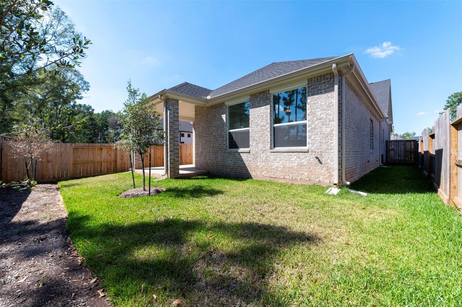 Exterior details and patio area of a home in The Woodlands Hills, Willis (Image 19). Exterior details and patio area of a home in The Woodlands Hills, Willis (Image 19).
