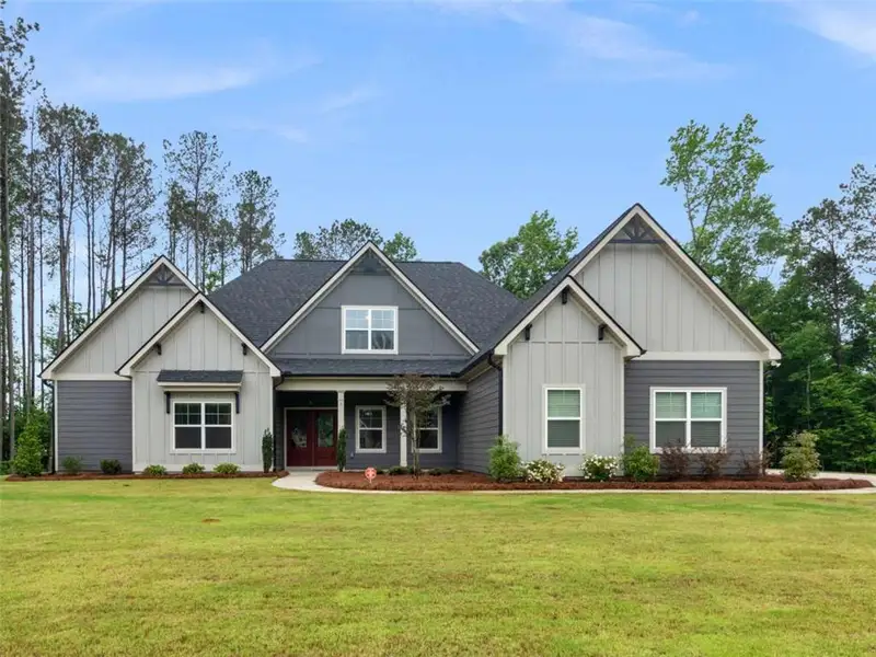 Front exterior of a new home in , Newnan, GA, highlighting curb appeal (Image 1). Front exterior of a new home in , Newnan, GA, highlighting curb appeal (Image 1).