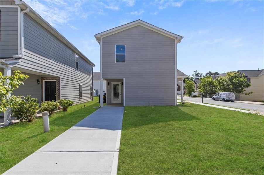Front exterior of a new home in , Fairburn, GA, highlighting curb appeal (Image 2). Front exterior of a new home in , Fairburn, GA, highlighting curb appeal (Image 2).