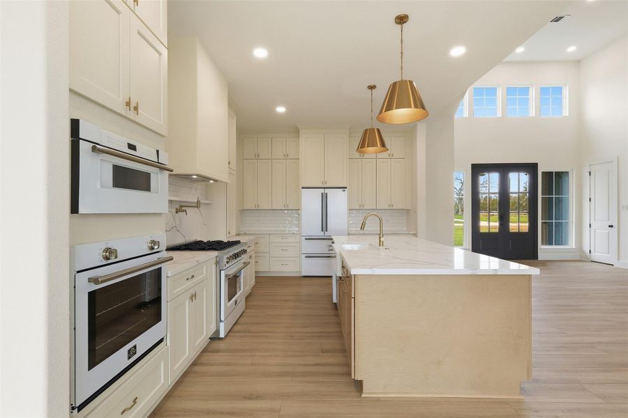 Photos are of prior LOTUS plan homesite built by Aurcova. Photos are of prior LOTUS plan homesite built by Aurcova.