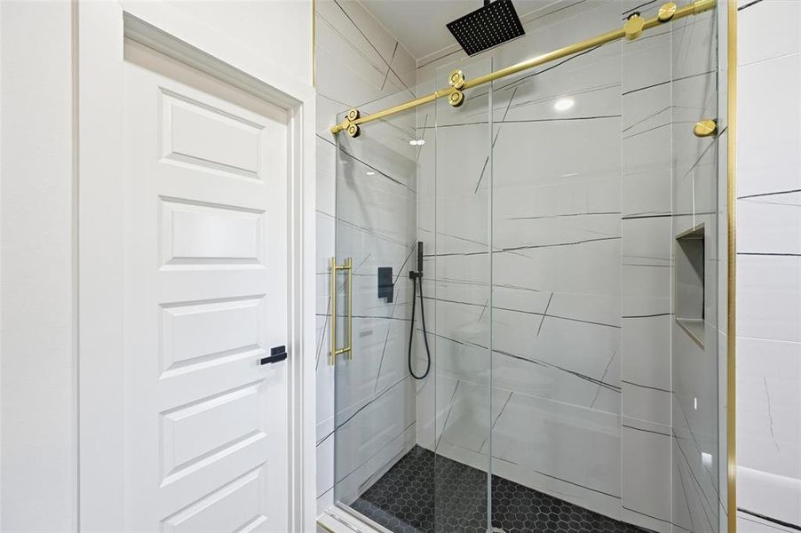 Bathroom with a shower stall Bathroom with a shower stall