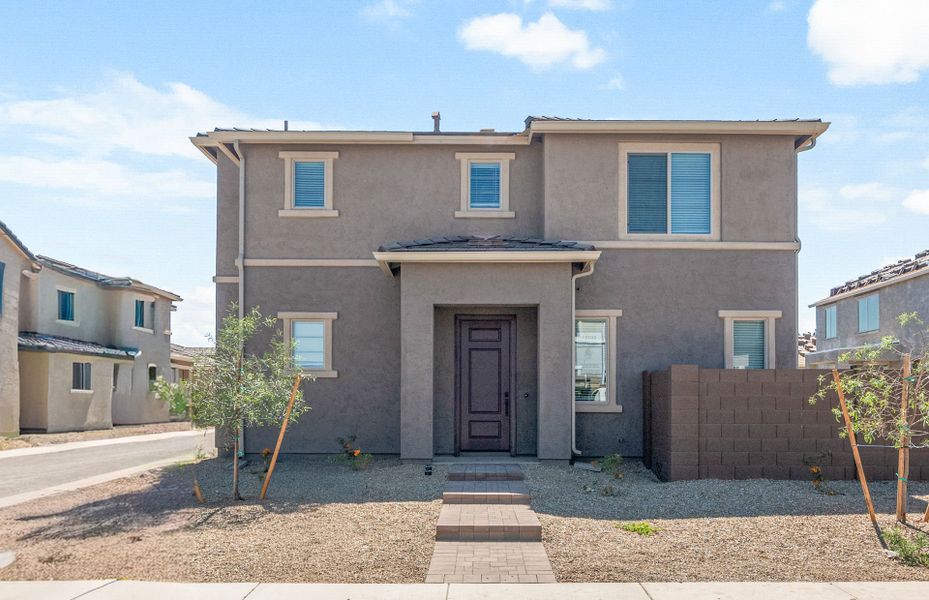 Front exterior of a new home in Asante- Atrium Series, Surprise, AZ, highlighting curb appeal (Image 19).