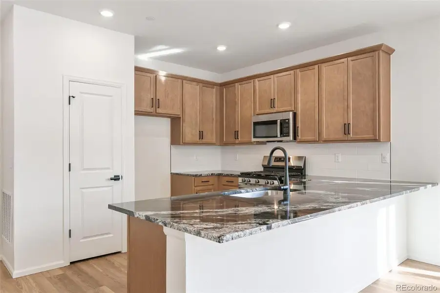 Furnished interior view inside a new home in Turnberry Villas, Commerce City (Image 13).