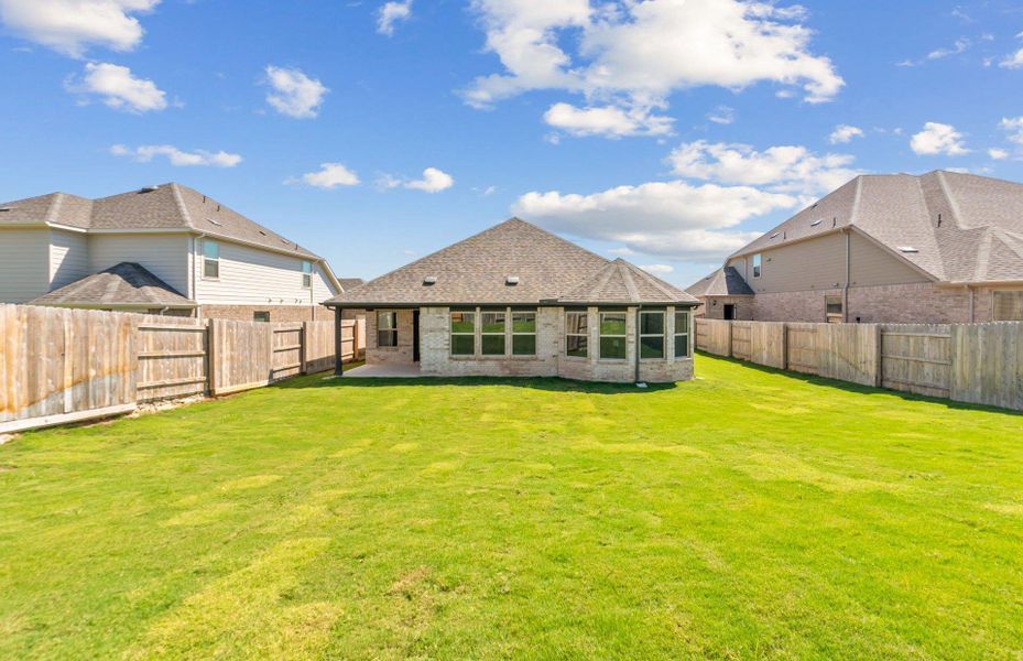 Front exterior of a new home in Crescent Bluff, Georgetown, TX, highlighting curb appeal (Image 2).