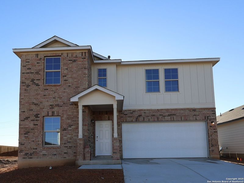 Front exterior of a new home in Agave, San Antonio, TX, highlighting curb appeal (Image 21).