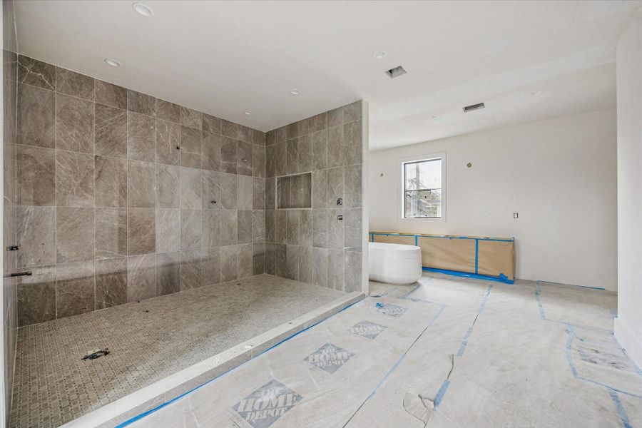 Spa like primary bathroom includes wet room with soaking tub and dual showerheads. Spa like primary bathroom includes wet room with soaking tub and dual showerheads.