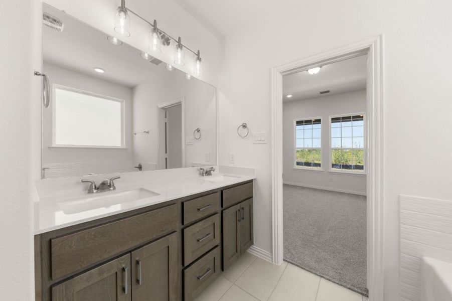 Representative furnished interior of a home built from the Cypress by UnionMain Homes in Edgewater, Fate (Image 14).