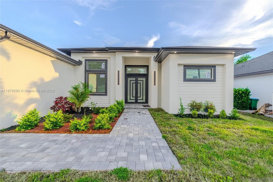 Front exterior of a new home in , Cape Coral, FL, highlighting curb appeal (Image 23).