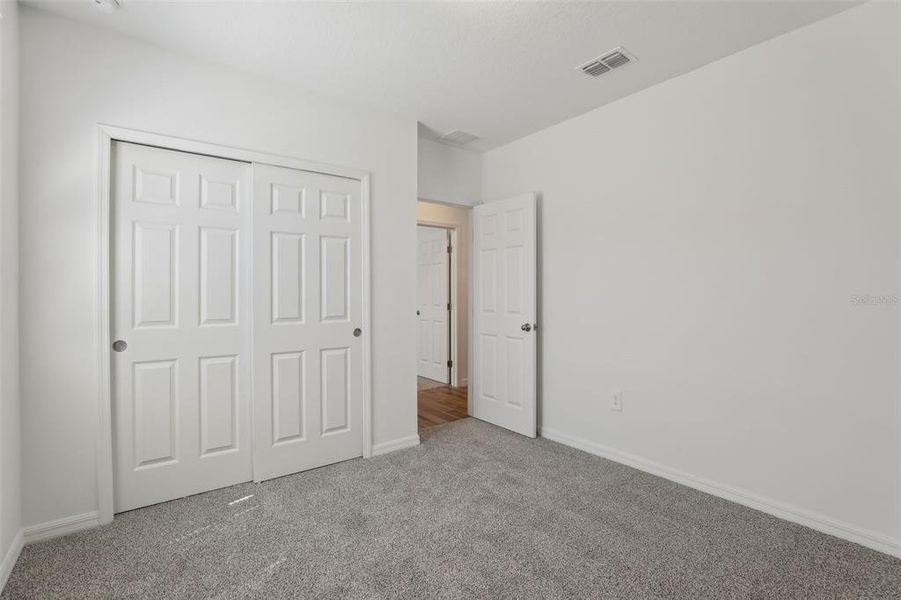 Spacious, unfurnished interior of a new home in Lawson Dunes - Signature Series, Haines City (Image 22).