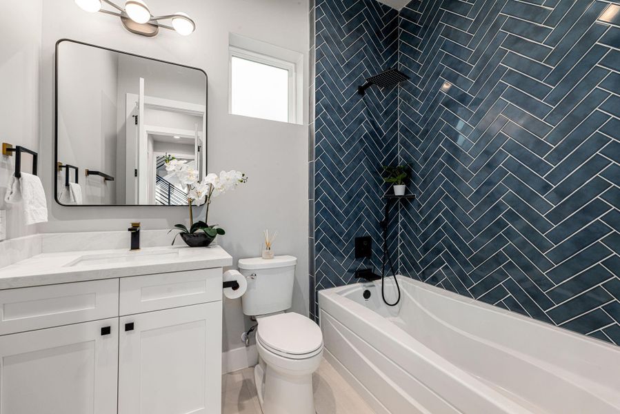 Full bath with premium finishes and a contemporary aesthetic Full bath with premium finishes and a contemporary aesthetic