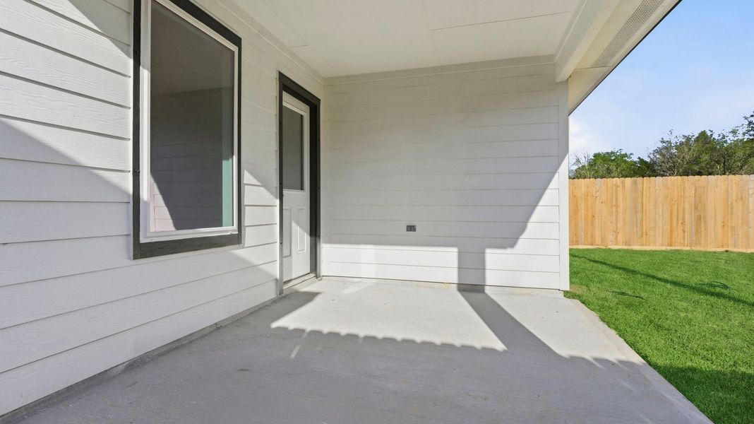 Exterior details and patio area of a home in Lakes at Westland Ranch, League City (Image 20).