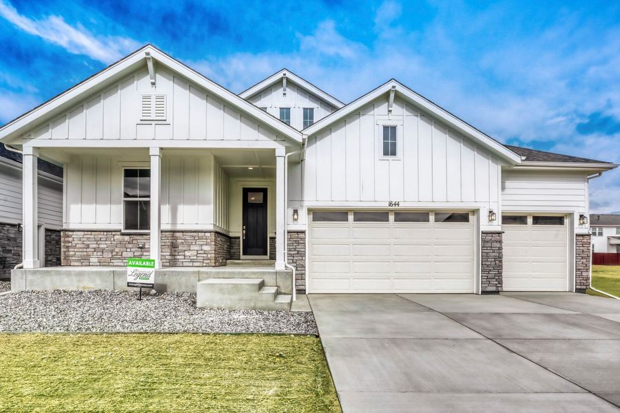 Front exterior of a new home in RainDance, Windsor, CO, highlighting curb appeal (Image 23).