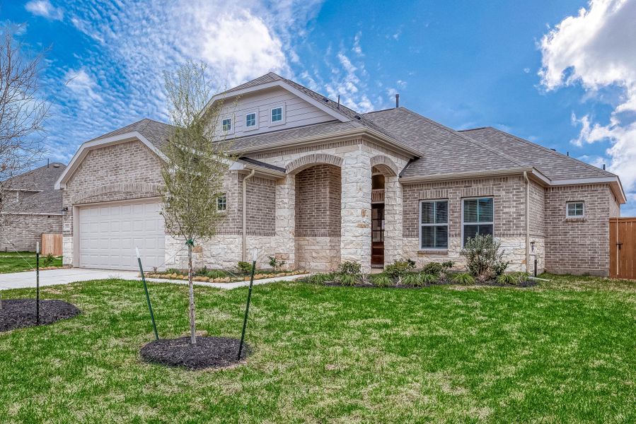 Representative exterior photo of a completed home built from the Floor Plan 1830 by Colina Homes in Grand Magnolia, Magnolia, TX (Image 28). Representative exterior photo of a completed home built from the Floor Plan 1830 by Colina Homes in Grand Magnolia, Magnolia, TX (Image 28).