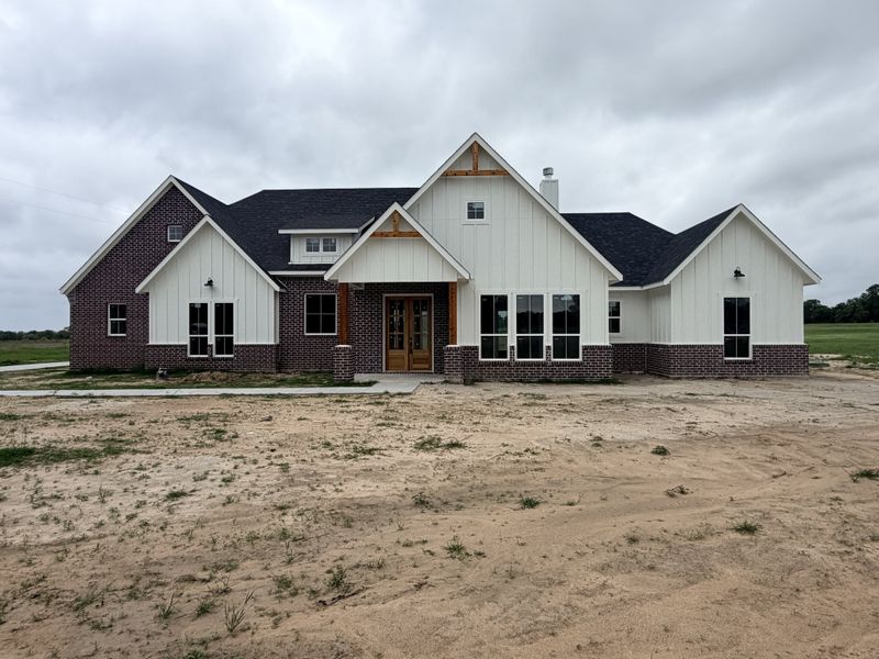 Front exterior of a new home in Oak Water Ranch, Granbury, TX, highlighting curb appeal (Image 22).